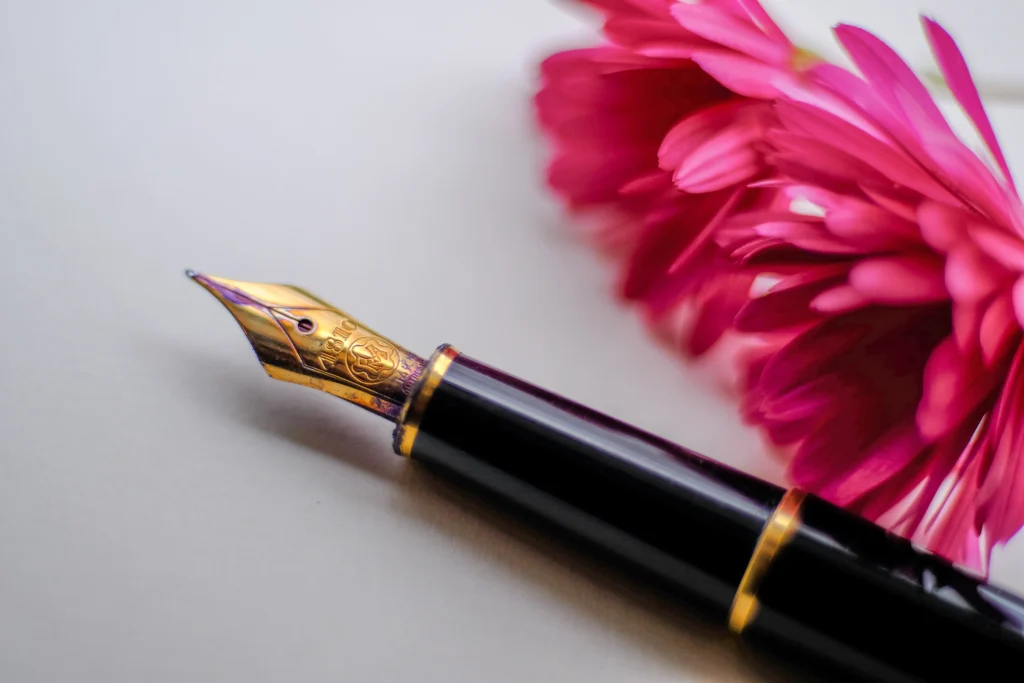 a fountain pen pointing away from the photographer